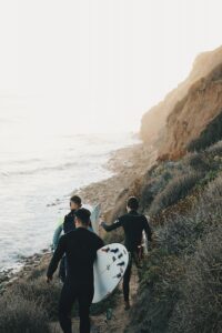 three men surfing