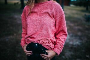 girl in pink sweater